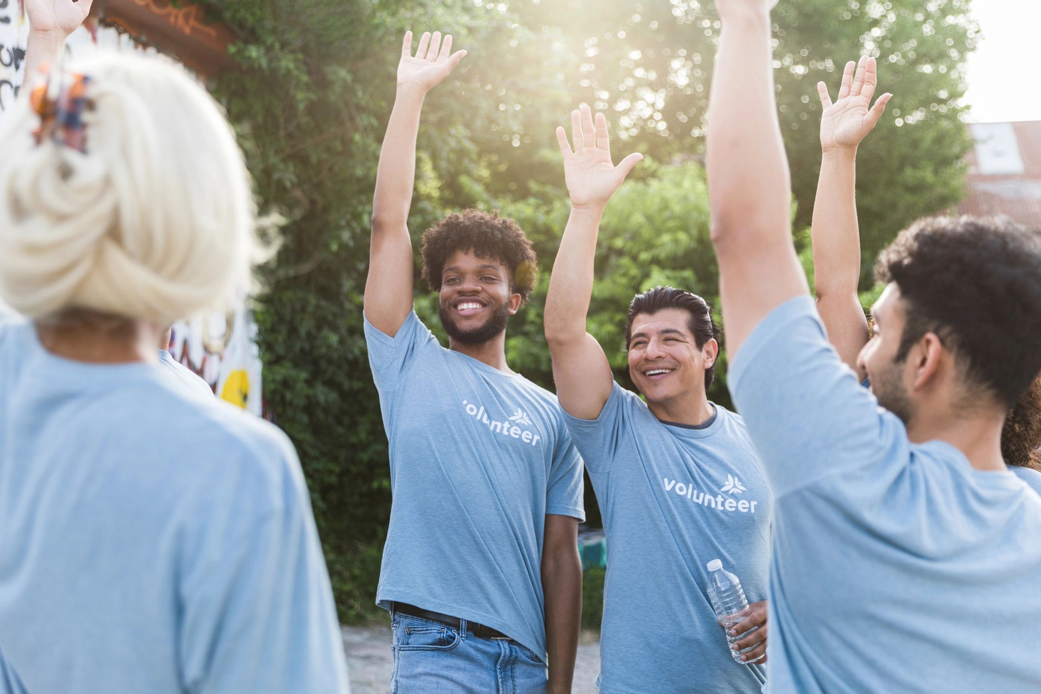 Volunteers cheering and smiling